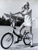 period photo of girl on porta cycle